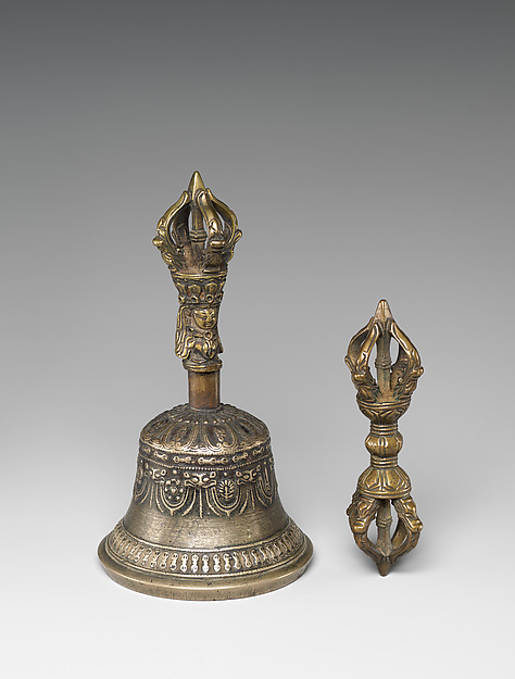 Nineteenth-century Tibetan bronze ritual bell beside a matching pronged vajra scepter